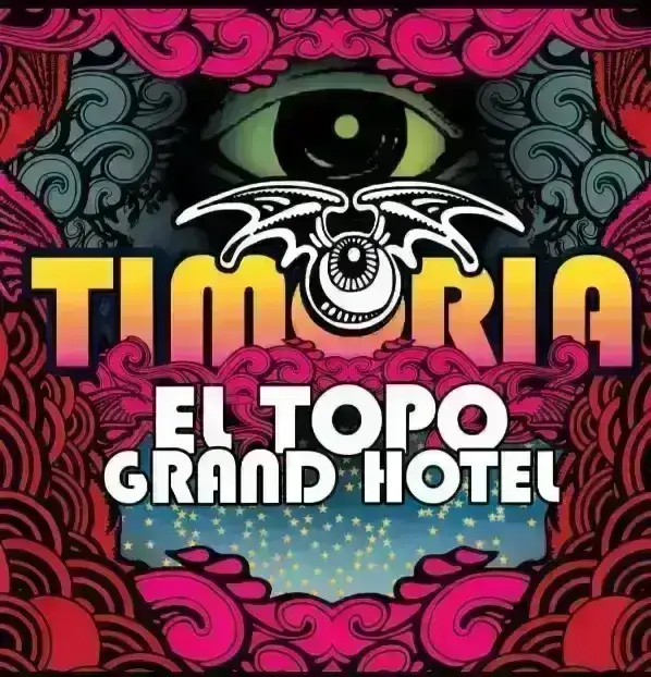 Copertina colorata con occhio verde centrale, logo Timoria giallo e scritta bianca "El Topo Grand Hotel" su sfondo